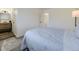 Light and airy bedroom with carpet, lamp, and bed with blue comforter at 12172 E Kepner Pl, Aurora, CO 80012