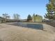 Community pool is covered for the winter months, surrounded by green townhomes and a wrought iron fence at 12172 E Kepner Pl, Aurora, CO 80012