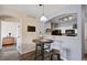 Modern kitchen with white cabinets and black appliances at 5255 Memphis St # 207, Denver, CO 80239