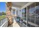 Small porch with seating and sliding glass door at 5255 Memphis St # 207, Denver, CO 80239