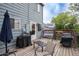 A wooden back deck area featuring patio furniture, space for grilling, and a backyard view at 10050 Holland Ct, Broomfield, CO 80021