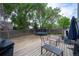 A large back yard with mature trees, trampoline, patio furniture, and a storage shed at 10050 Holland Ct, Broomfield, CO 80021