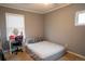 This bedroom features neutral walls, carpet flooring, and a vanity area next to a comfortably sized bed at 10050 Holland Ct, Broomfield, CO 80021