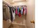 A walk-in closet with ample hanging storage space on rods to easily organize your clothing at 10050 Holland Ct, Broomfield, CO 80021