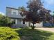 Charming two-story home with a well-maintained lawn and mature tree in a Gathering-friendly neighborhood at 10050 Holland Ct, Broomfield, CO 80021