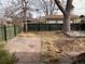 Backyard with flagstone patio, wood deck, and raised garden beds at 3044 Eudora St, Denver, CO 80207