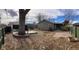 Large backyard with a flagstone patio, deck, and mature trees at 3044 Eudora St, Denver, CO 80207