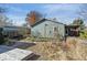 Backyard view showing house, deck, and landscaping at 3044 Eudora St, Denver, CO 80207