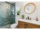 Modern bathroom with hexagon tile shower and updated vanity at 3044 Eudora St, Denver, CO 80207