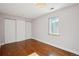 Serene bedroom with hardwood floors and a spacious closet at 3044 Eudora St, Denver, CO 80207