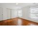 Spacious bedroom featuring hardwood floors and large closet at 3044 Eudora St, Denver, CO 80207