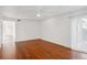 Bright bedroom with hardwood floors and access to hallway at 3044 Eudora St, Denver, CO 80207