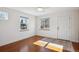 Light-filled entryway with hardwood floors and neutral walls at 3044 Eudora St, Denver, CO 80207