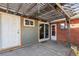 Covered patio with brick wall and sliding glass door at 3044 Eudora St, Denver, CO 80207