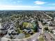 The aerial view highlights community amenities including a pool, tennis courts, and lush landscaping at 6960 S Knolls Way, Centennial, CO 80122