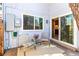 Charming back patio with seating and sliding glass door, perfect for relaxing and entertaining guests at 6960 S Knolls Way, Centennial, CO 80122