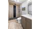 A stylish bathroom with rain shower and wood tile accents and an undermount sink at 6960 S Knolls Way, Centennial, CO 80122