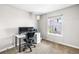Home office features a neutral color palette, carpeted floor, and natural light from a window at 6960 S Knolls Way, Centennial, CO 80122