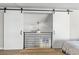 Bedroom view showcases sliding barn doors that frame the loft area at 6960 S Knolls Way, Centennial, CO 80122
