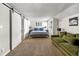 Spacious bedroom features a comfortable sitting area, ample natural light, and a modern aesthetic at 6960 S Knolls Way, Centennial, CO 80122