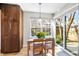 Cozy dining area featuring natural light, a wooden table with chairs, and a sliding glass door to the outside at 6960 S Knolls Way, Centennial, CO 80122