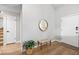 Inviting entryway features hardwood floors, a wooden bench, stylish mirror, and ample natural light at 6960 S Knolls Way, Centennial, CO 80122