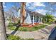 Charming home with a brick chimney, lovely landscaping, and well-maintained lawn at 6960 S Knolls Way, Centennial, CO 80122