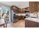 Modern kitchen featuring stainless steel appliances, granite countertops, and ample cabinet space at 6960 S Knolls Way, Centennial, CO 80122