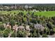 Expansive aerial shot capturing a home surrounded by mature trees and park at 1040 N Humboldt St, Denver, CO 80218