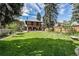 Sprawling backyard with well-maintained lawn and charming brick home, perfect for outdoor enjoyment at 1040 N Humboldt St, Denver, CO 80218