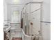 Clean bathroom with a glass enclosed shower, and white tile, offering a bright and functional space at 1040 N Humboldt St, Denver, CO 80218