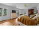 Comfortable bedroom with hardwood floors, light walls, and a balcony overlooking a green landscape at 1040 N Humboldt St, Denver, CO 80218