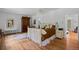 Bright bedroom with a decorative stained glass accent window and hardwood flooring at 1040 N Humboldt St, Denver, CO 80218
