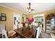 Traditional dining room with a wood table, upholstered chairs, and a view into the kitchen at 1040 N Humboldt St, Denver, CO 80218