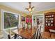 Bright dining room with a large window, wood table, upholstered chairs, and hardwood floors at 1040 N Humboldt St, Denver, CO 80218