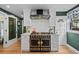 Gourmet kitchen featuring a vintage-style gas range and hood at 1040 N Humboldt St, Denver, CO 80218