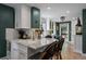Beautiful kitchen with marble countertops and a view into the backyard at 1040 N Humboldt St, Denver, CO 80218