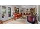 Warm living room featuring a fireplace, mantel, and french door to balcony at 1040 N Humboldt St, Denver, CO 80218