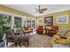 Spacious living room with seating, complemented by stained glass windows at 1040 N Humboldt St, Denver, CO 80218