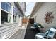 Private backyard with patio seating and string lights, perfect for outdoor enjoyment at 5450 Uinta St, Denver, CO 80238