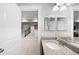 Bathroom view shows a granite vanity top and modern door looking out to an open area at 5450 Uinta St, Denver, CO 80238