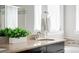 Bright bathroom vanity boasts granite countertops and modern fixtures for a luxurious feel at 5450 Uinta St, Denver, CO 80238