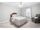 Comfortable bedroom with neutral palette, plush bedding, and abundant natural light at 5450 Uinta St, Denver, CO 80238