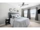 Bright bedroom features a comfortable bed, neutral decor, and ample natural light at 5450 Uinta St, Denver, CO 80238