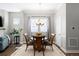 Cozy dining room featuring a round table, chandelier lighting, and neutral decor at 5450 Uinta St, Denver, CO 80238