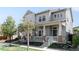 Beautiful two-story home with a cozy front porch, brick accents, and manicured lawn at 5450 Uinta St, Denver, CO 80238