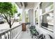 Inviting front porch with cozy seating and views of the neighborhood at 5450 Uinta St, Denver, CO 80238