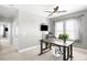 Home office featuring a modern desk, ceiling fan, and bright windows for plenty of natural light at 5450 Uinta St, Denver, CO 80238
