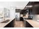 Stylish kitchen with granite countertops, stainless appliances and a large island at 5450 Uinta St, Denver, CO 80238