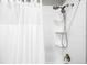 Modern shower with white subway tile, chrome fixtures and glass door with handheld shower head at 5450 Uinta St, Denver, CO 80238